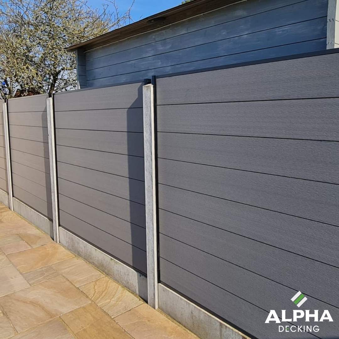 Grey composite fencing along a property boundary