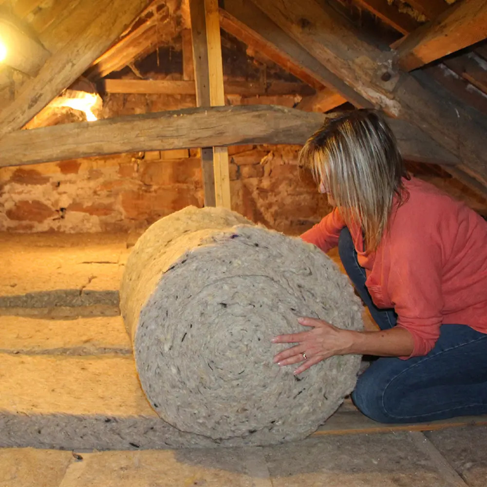 Sheep's wool loft insulation fitted between joists — Central Scotland